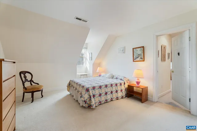 a view of a workspace with furniture and a workspace