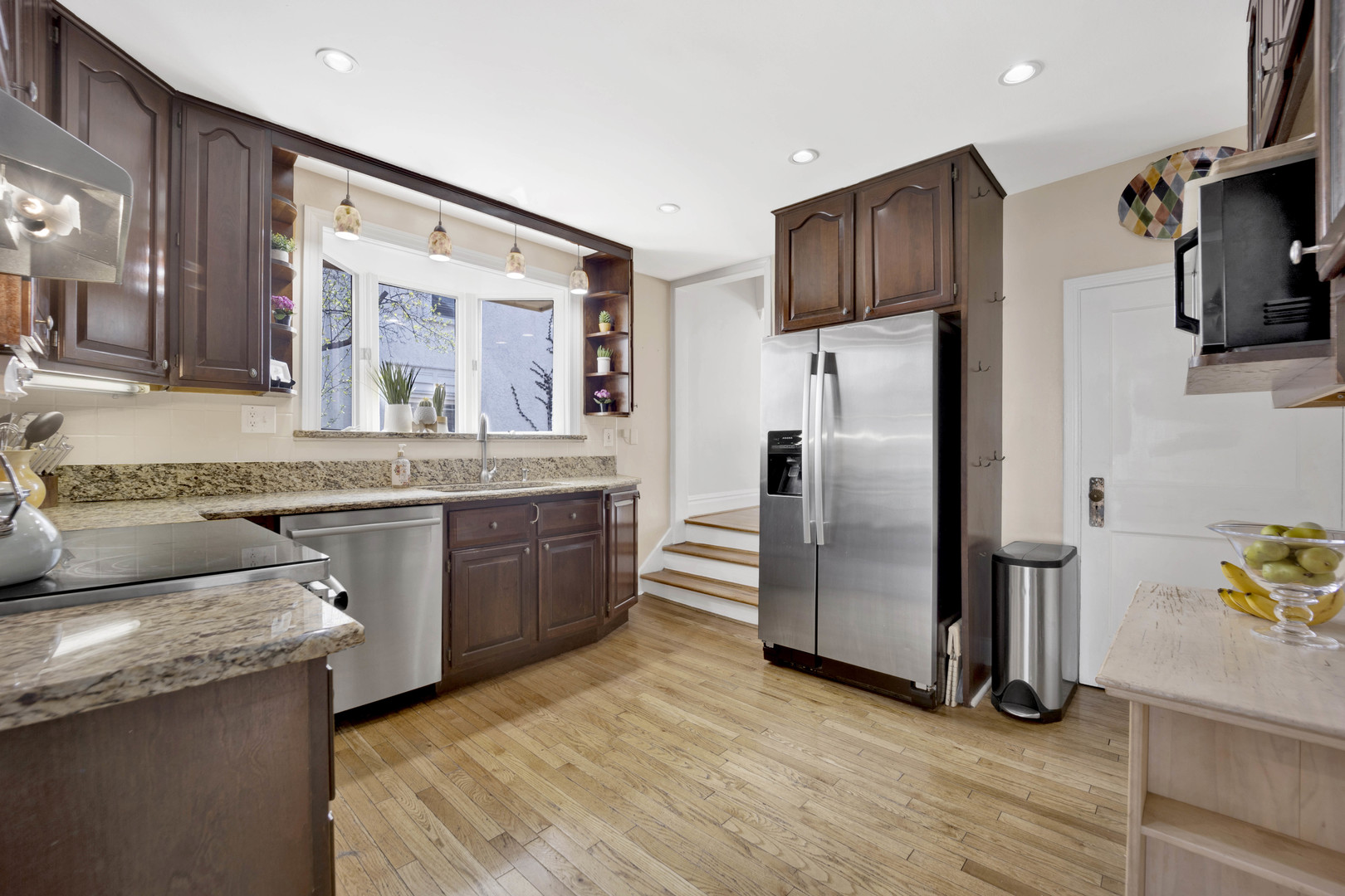 39 North Delaplaine Road Riverside, IL 60546 - Photo 8 of 33 a kitchen with stainless steel appliances granite countertop a refrigerator a stove and a sink