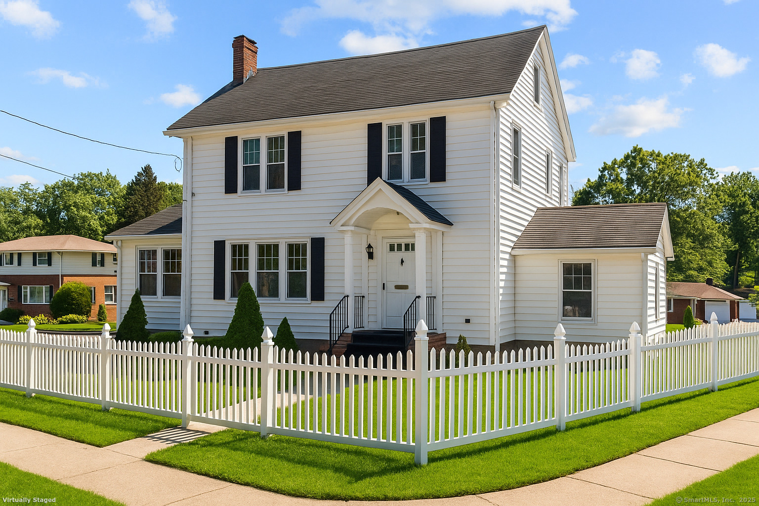 a front view of a house with a garden