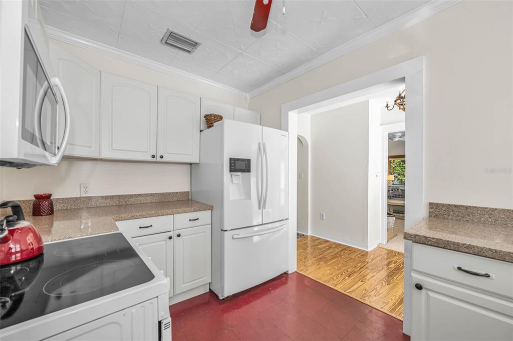 525 Bay Street Dunedin, FL 34698 - Photo 15 of 38 a kitchen with appliances and cabinets