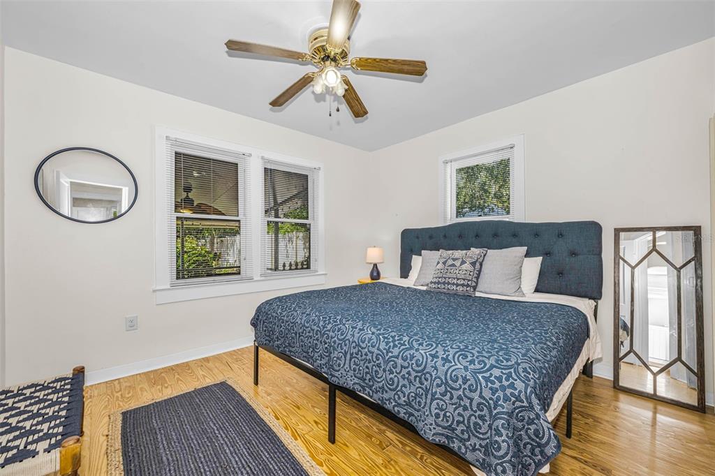 525 Bay Street Dunedin, FL 34698 - Photo 18 of 38 a bedroom with a large bed and a window