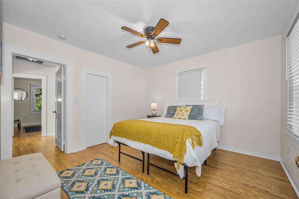525 Bay Street Dunedin, FL 34698 - Photo 20 of 38 a bed room with a bed and a couch