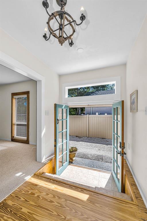 525 Bay Street Dunedin, FL 34698 - Photo 2 of 38 a view of a hall way with entryway and front door