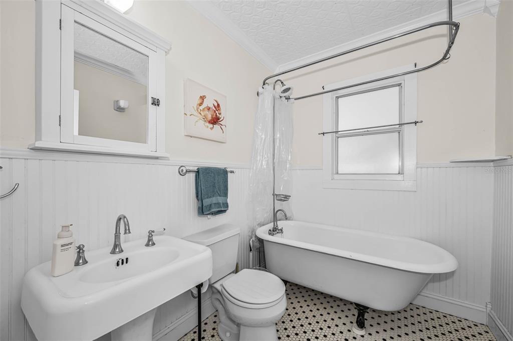 525 Bay Street Dunedin, FL 34698 - Photo 21 of 38 a bathroom with a sink toilet and shower