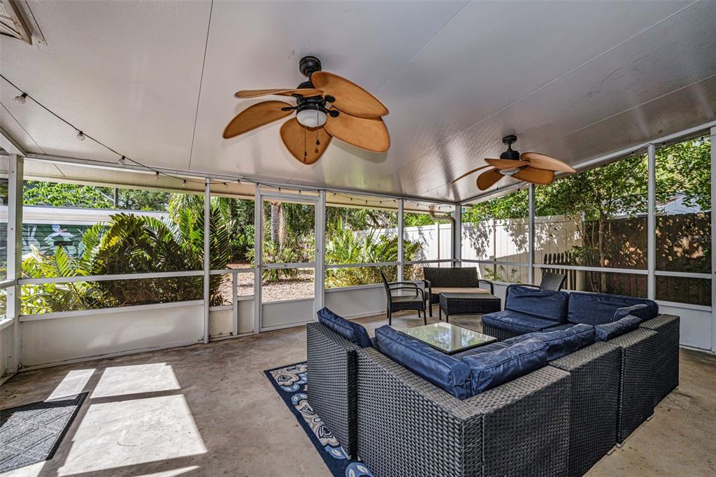 525 Bay Street Dunedin, FL 34698 - Photo 25 of 38 a view of a tables and chairs in patio