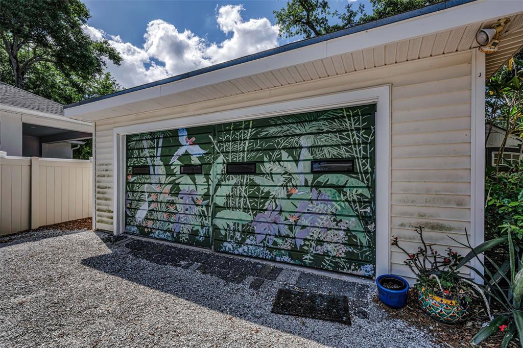 525 Bay Street Dunedin, FL 34698 - Photo 26 of 38 a front view of a house with a yard and potted plants