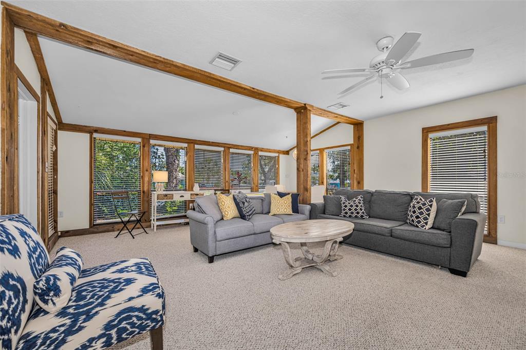 525 Bay Street Dunedin, FL 34698 - Photo 3 of 38 a living room with furniture and a large window
