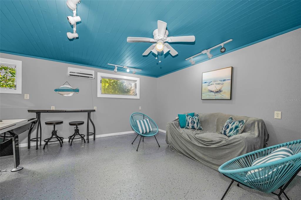 525 Bay Street Dunedin, FL 34698 - Photo 31 of 38 a living room with furniture and a window