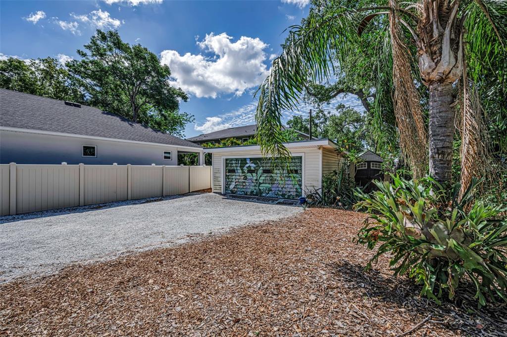 525 Bay Street Dunedin, FL 34698 - Photo 38 of 38 a backyard of a house with lots of green space