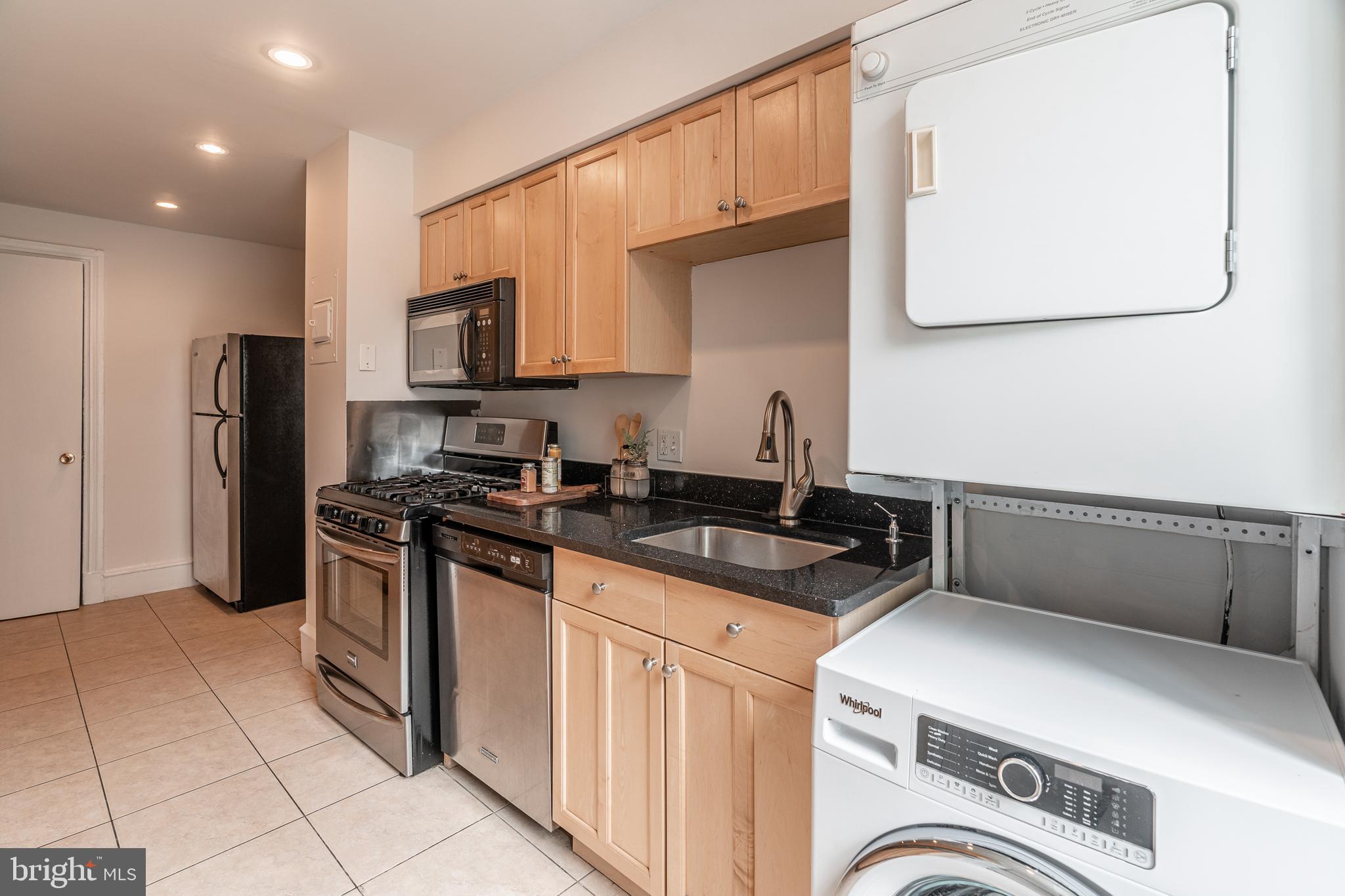 2201 Chestnut Street, Unit 204 Philadelphia, PA 19103 - Photo 18 of 24 Kitchen with washer/dryer