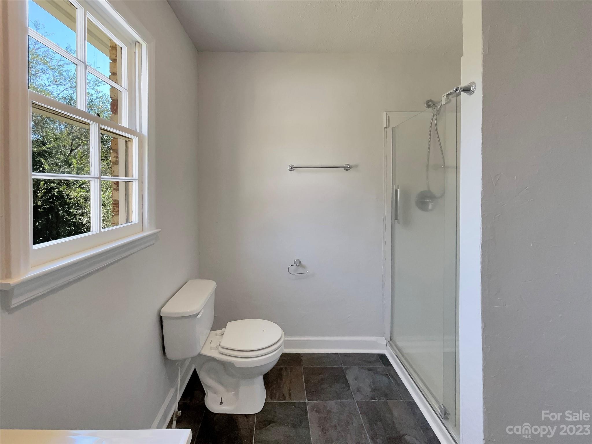 1904 Bess Town Road Bessemer City, NC 28016 - Photo 13 of 18 a white toilet sitting next to a bathroom sink