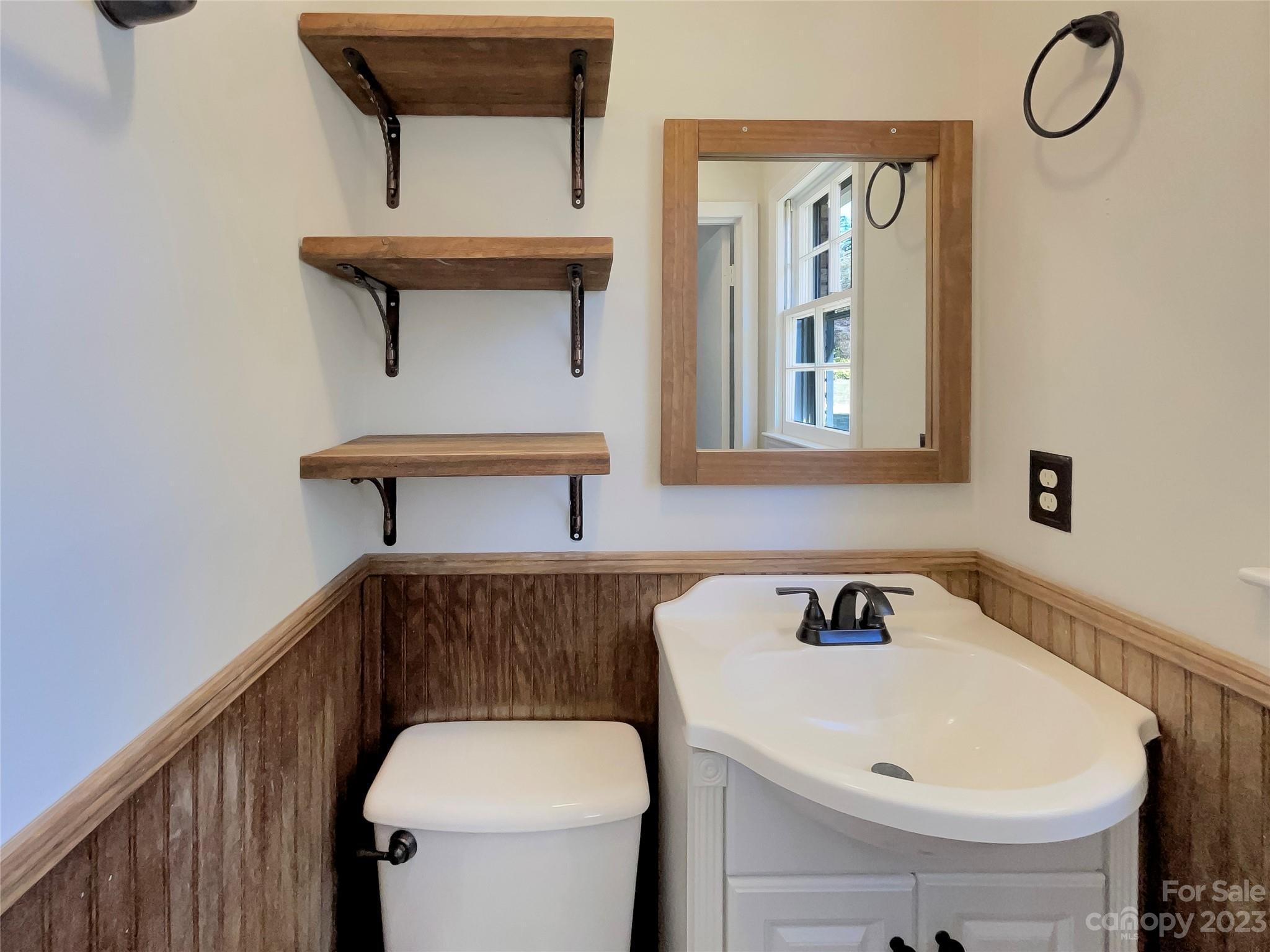 1904 Bess Town Road Bessemer City, NC 28016 - Photo 15 of 18 a bathroom with a sink and a toilet