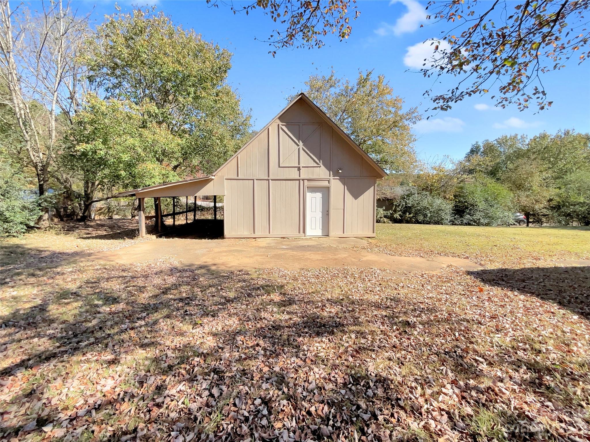 1904 Bess Town Road Bessemer City, NC 28016 - Photo 18 of 18 a view of house with yard and trees in the background