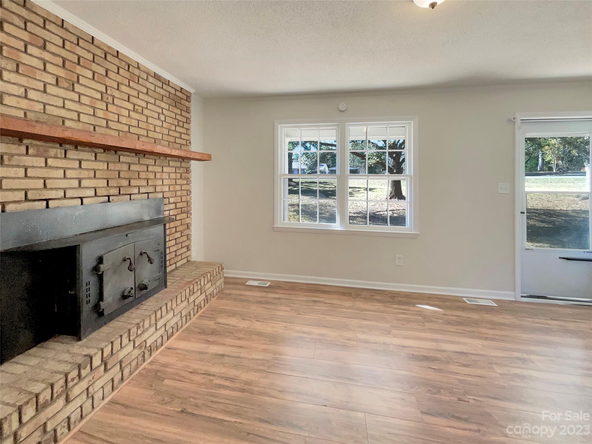 1904 Bess Town Road Bessemer City, NC 28016 - Photo 7 of 18 a view of an empty room with a window