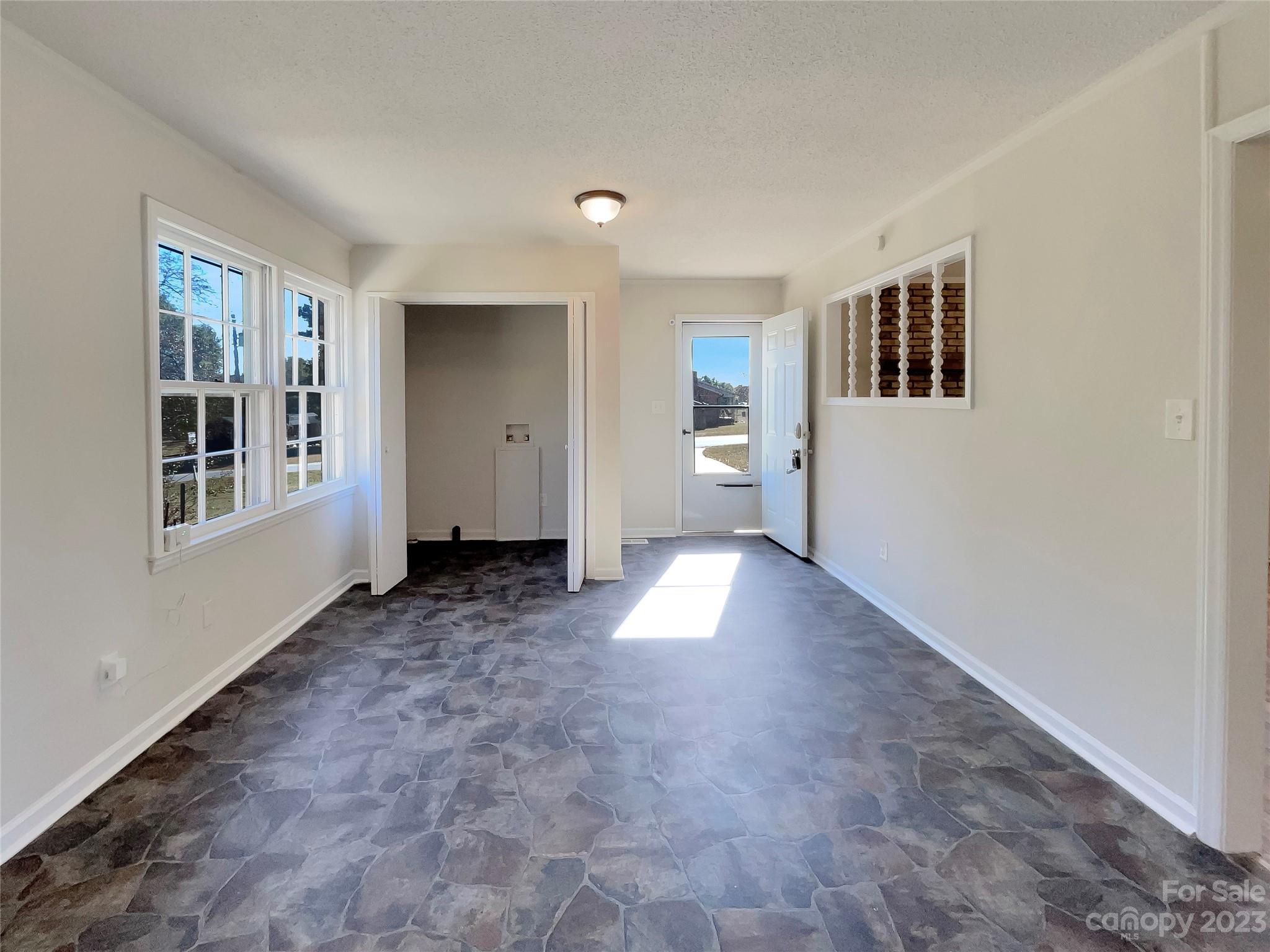 1904 Bess Town Road Bessemer City, NC 28016 - Photo 8 of 18 a view of a big room with windows and cabinet