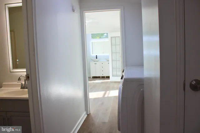 a en suite bathroom with a sink and a mirror