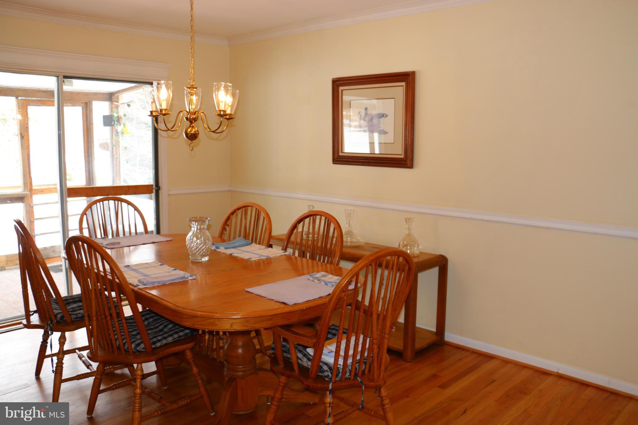 13831 Manor Road Baldwin, MD 21013 - Photo 2 of 20 a view of a dining room with furniture and chandelier