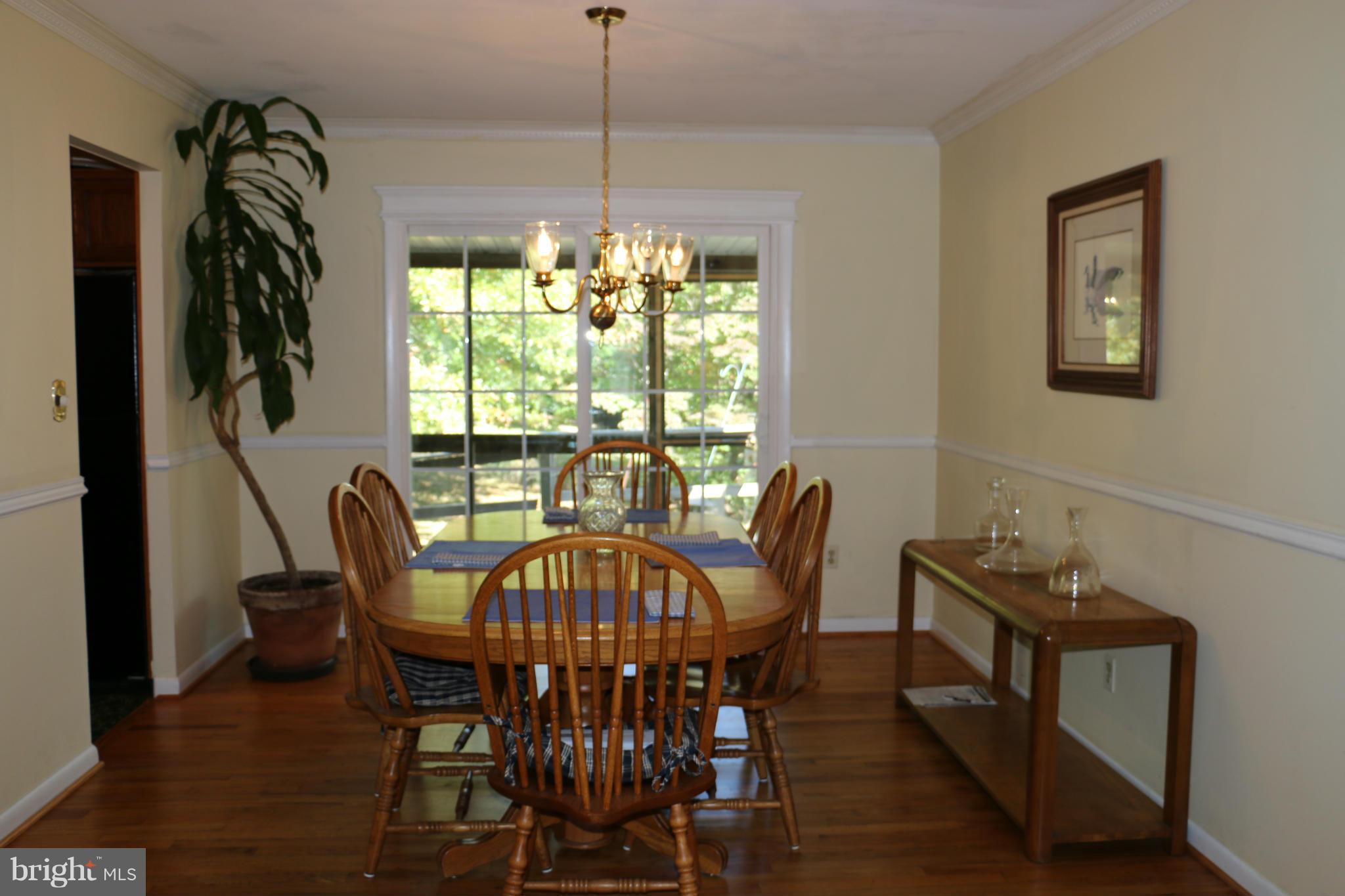13831 Manor Road Baldwin, MD 21013 - Photo 11 of 20 a view of a dining room with furniture window and outside view