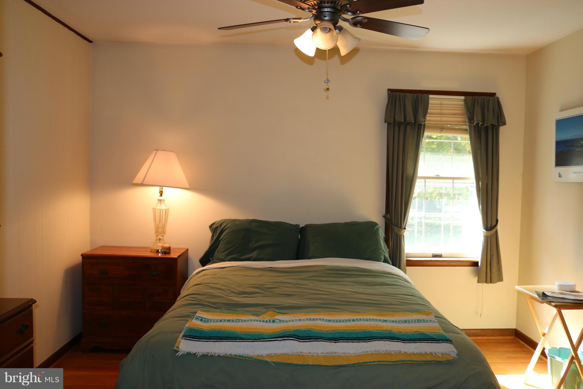 13831 Manor Road Baldwin, MD 21013 - Photo 14 of 20 a bedroom with a bed and a window