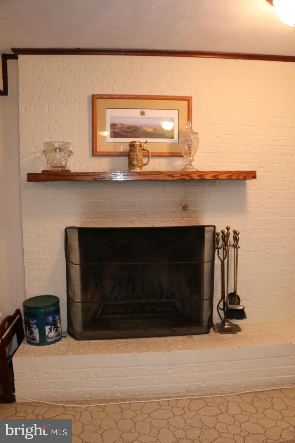 13831 Manor Road Baldwin, MD 21013 - Photo 16 of 20 a fireplace with stainless steel appliances
