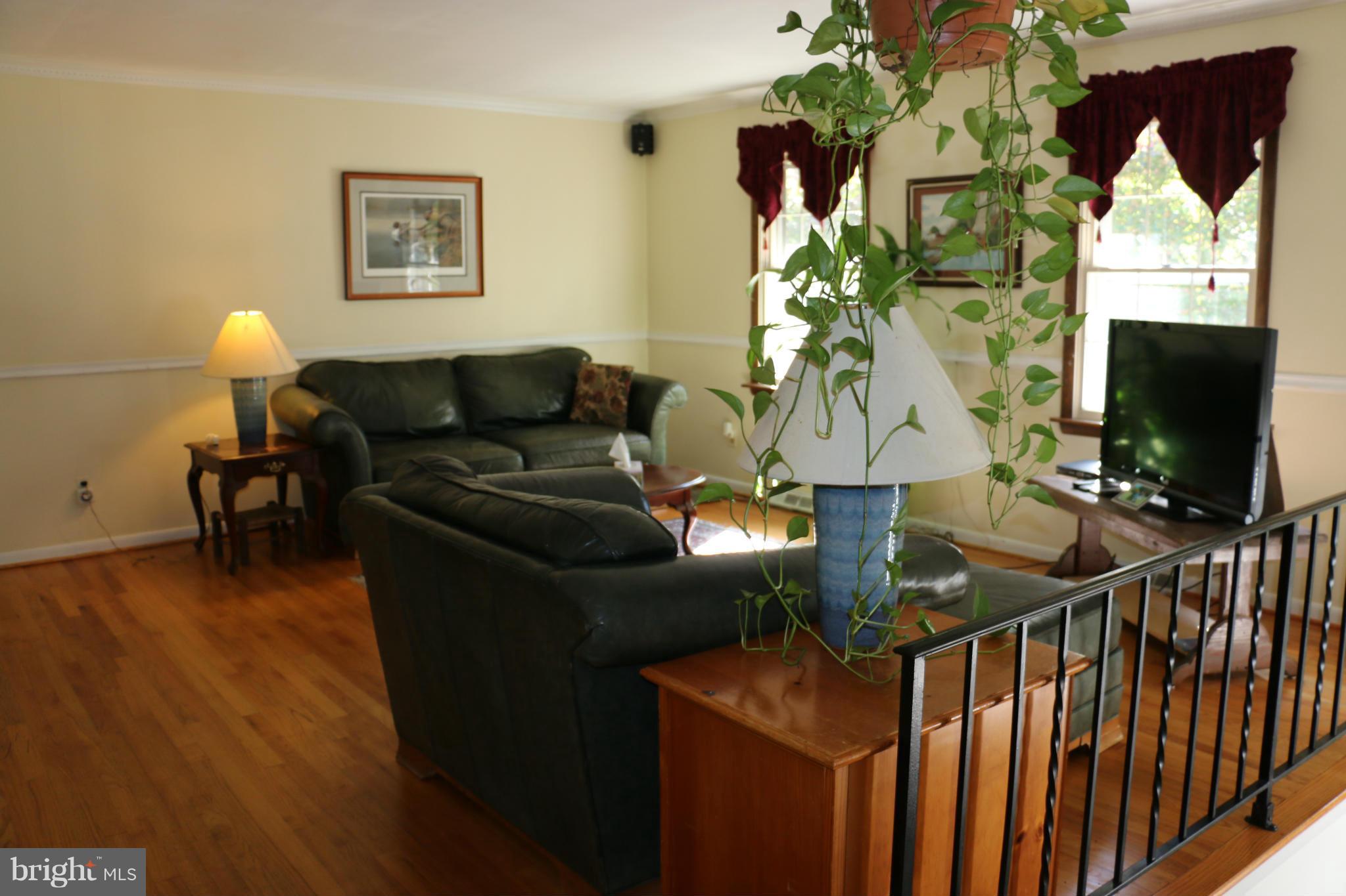 13831 Manor Road Baldwin, MD 21013 - Photo 3 of 20 a living room with furniture and a flat screen tv