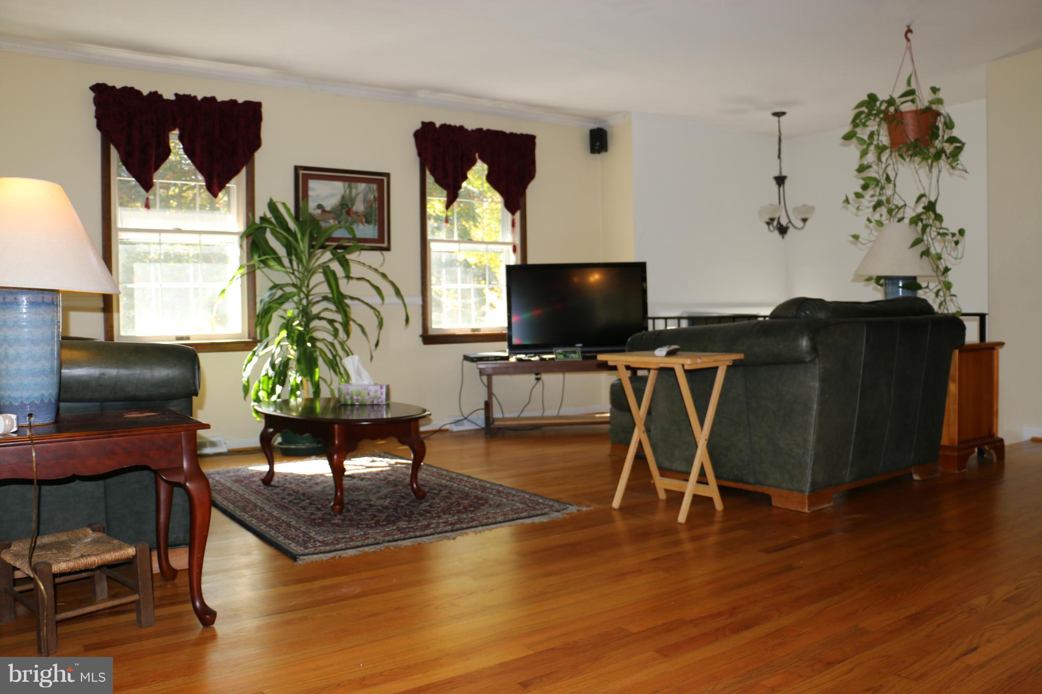 13831 Manor Road Baldwin, MD 21013 - Photo 9 of 20 a workspace with furniture and a wooden floor