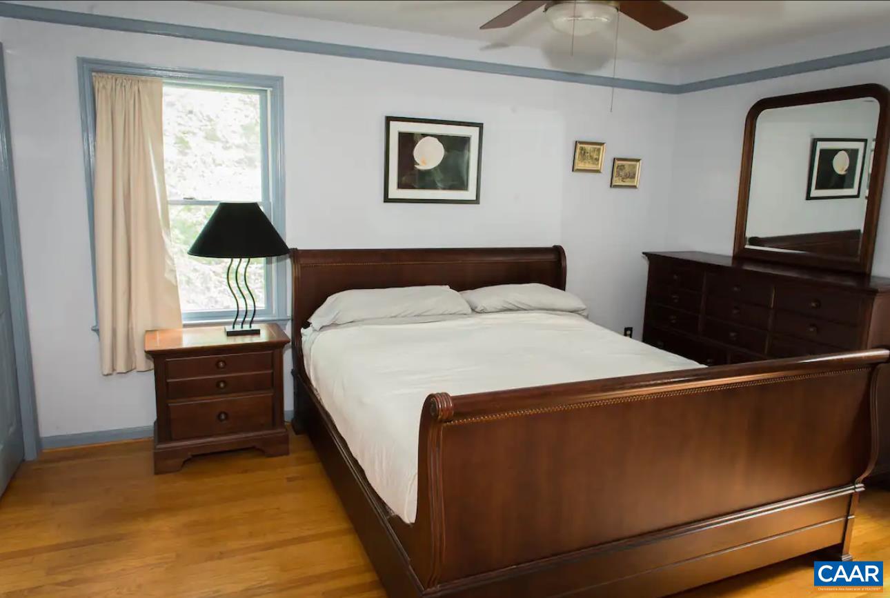 3034 Thrift Road Madison, VA 22727 - Photo 11 of 26 a bed room with a bed and a window