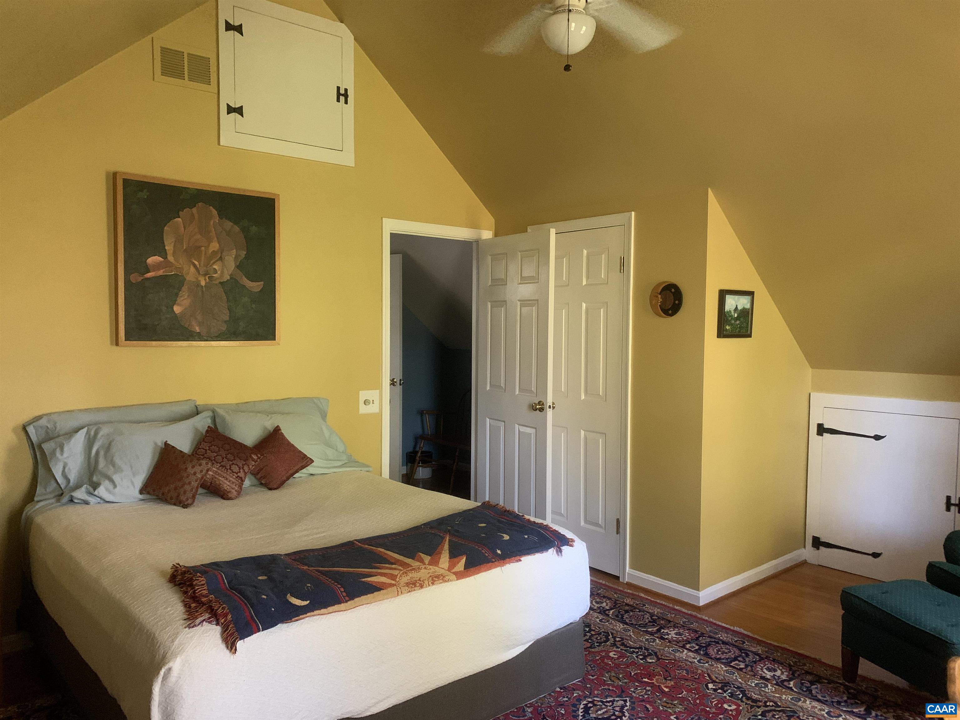 3034 Thrift Road Madison, VA 22727 - Photo 12 of 26 a bedroom with a bed and a chandelier