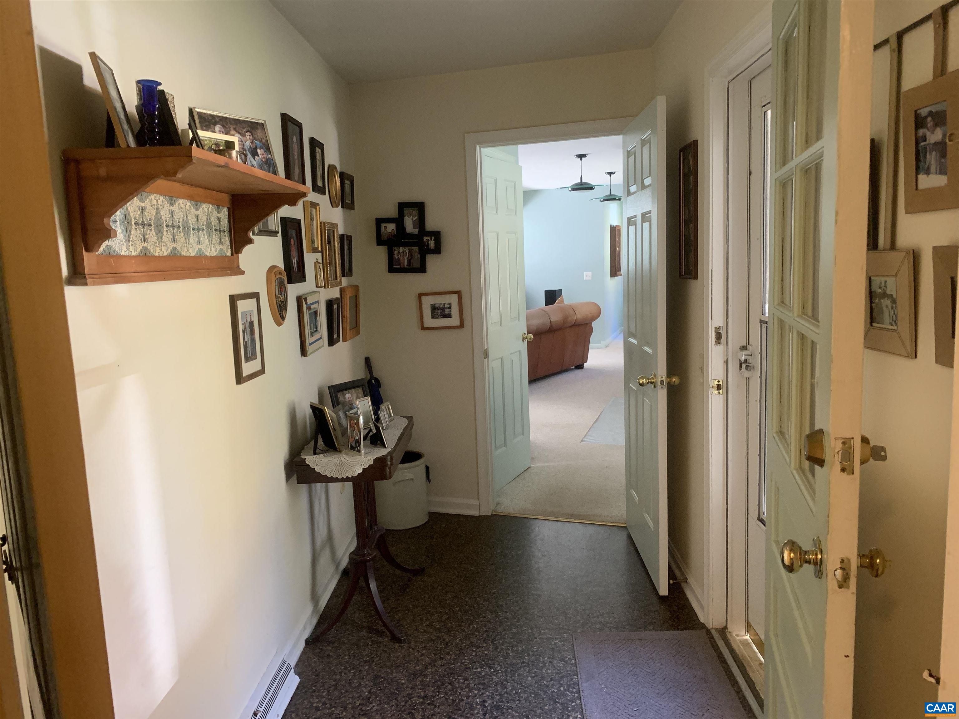 3034 Thrift Road Madison, VA 22727 - Photo 15 of 26 a view of a hallway to a livingroom with furniture