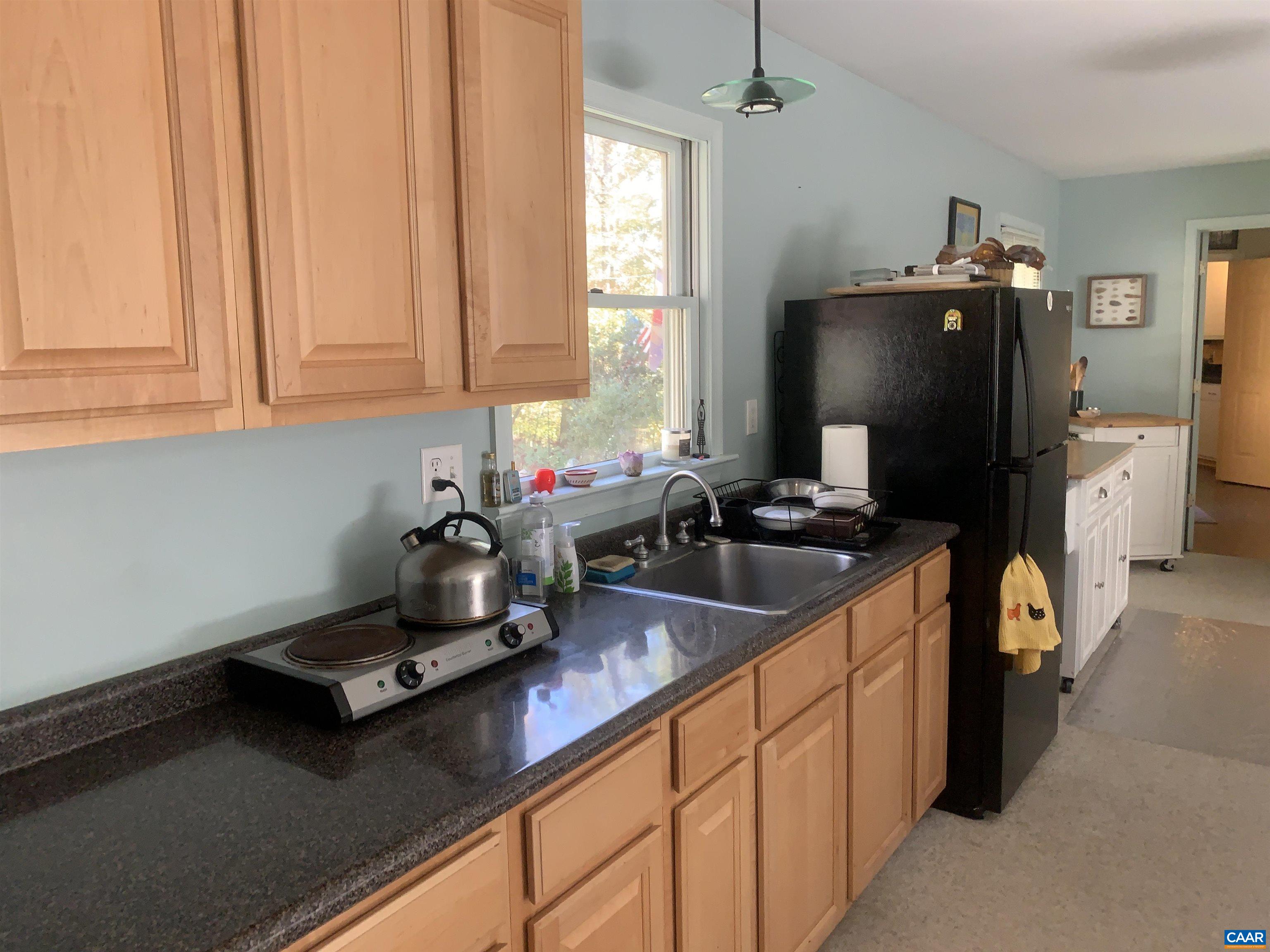 3034 Thrift Road Madison, VA 22727 - Photo 19 of 26 a kitchen with a sink appliances and cabinets