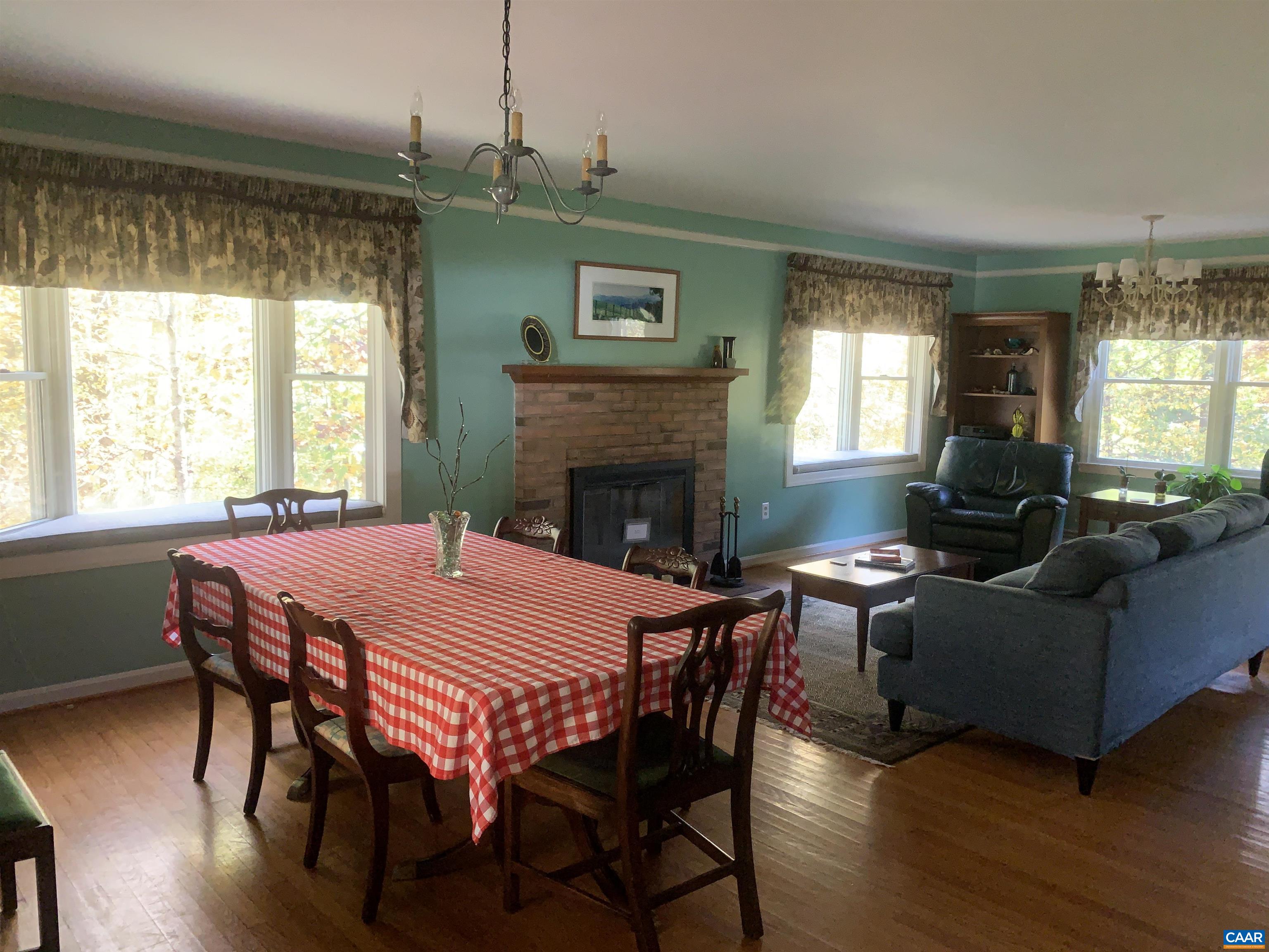 3034 Thrift Road Madison, VA 22727 - Photo 7 of 26 a view of a dining room with furniture window and wooden floor