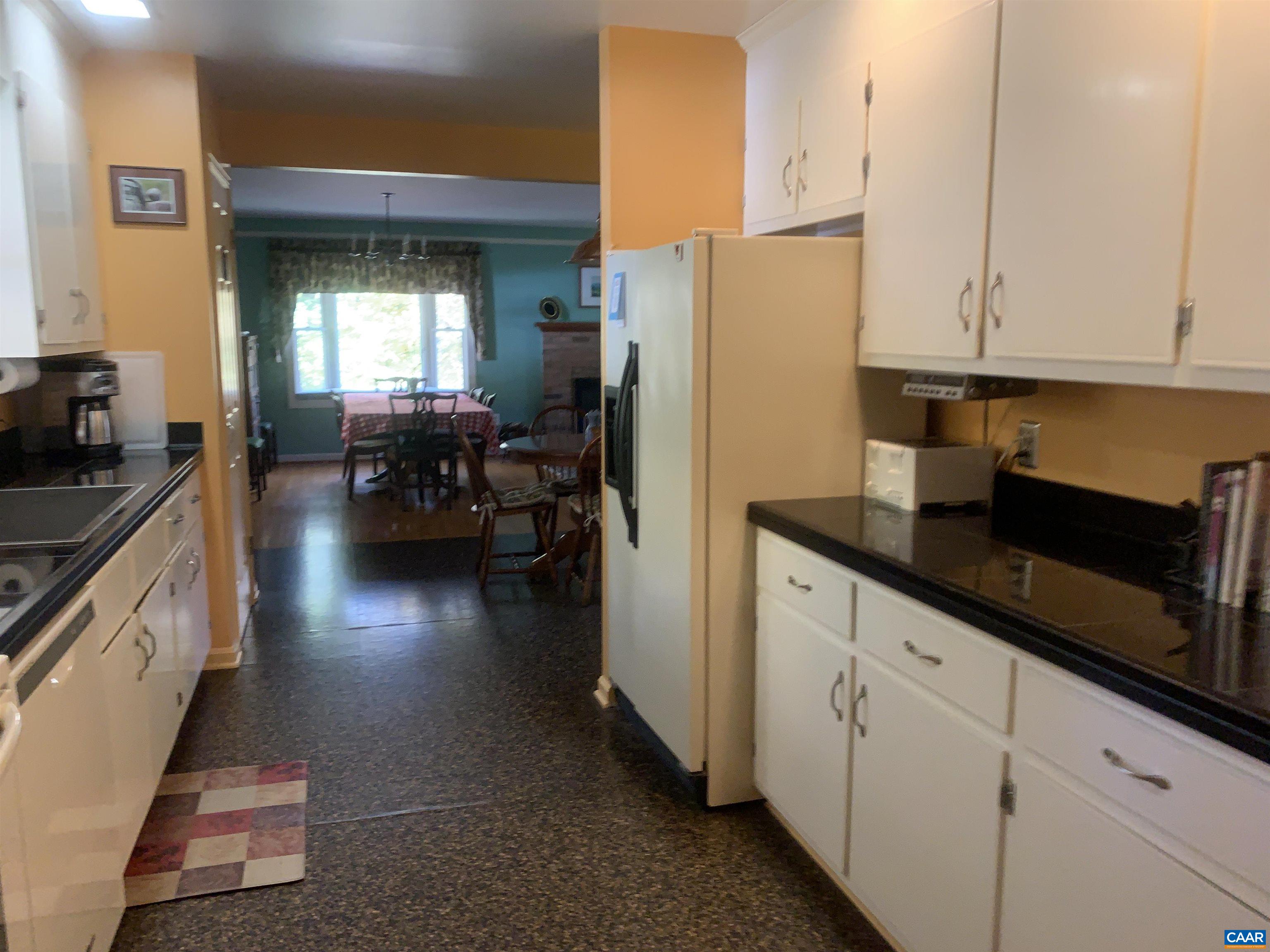 3034 Thrift Road Madison, VA 22727 - Photo 10 of 26 a kitchen with refrigerator and cabinets