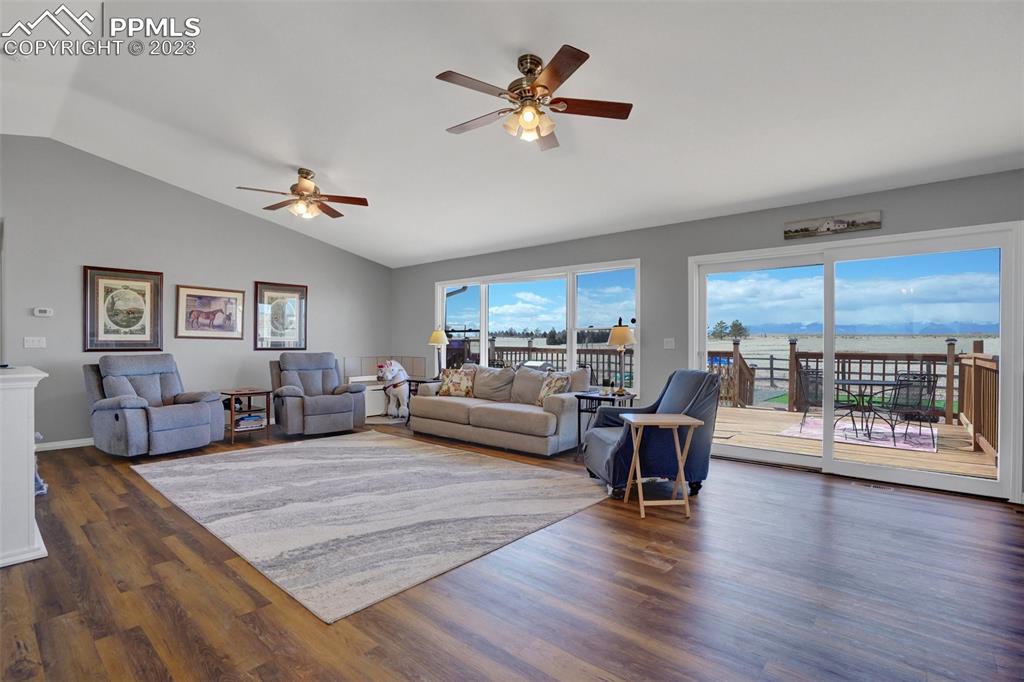 3805 Curtis Road Peyton, CO 80831 - Photo 11 of 48 a living room with furniture and wooden floor