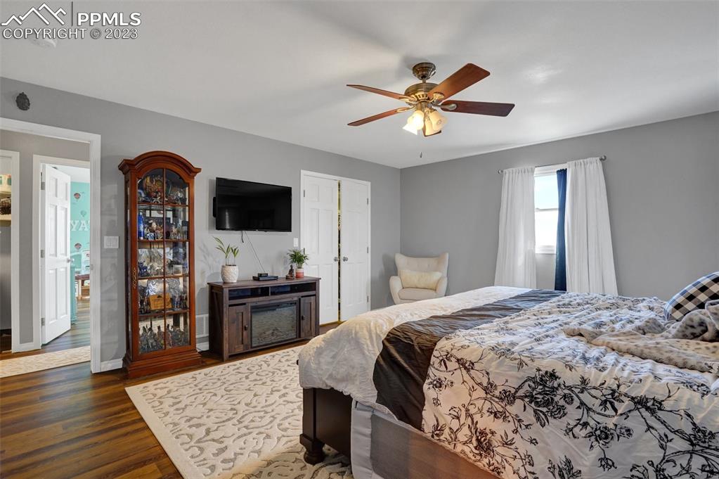 3805 Curtis Road Peyton, CO 80831 - Photo 24 of 48 a bedroom with a bed and a flat screen tv