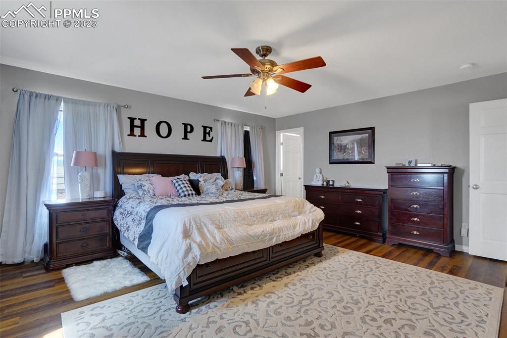 3805 Curtis Road Peyton, CO 80831 - Photo 25 of 48 a bedroom with a bed and a dresser