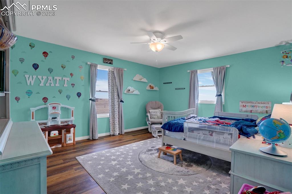 3805 Curtis Road Peyton, CO 80831 - Photo 28 of 48 a living room with furniture and a wooden floor