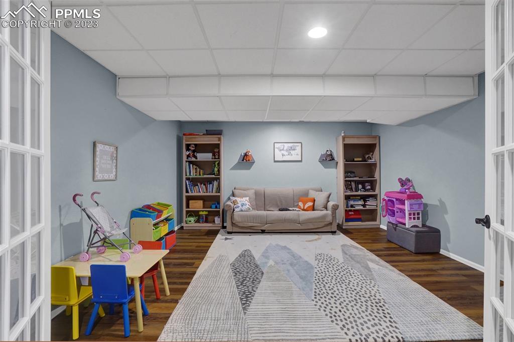 3805 Curtis Road Peyton, CO 80831 - Photo 34 of 48 a living room with furniture and a wooden floor