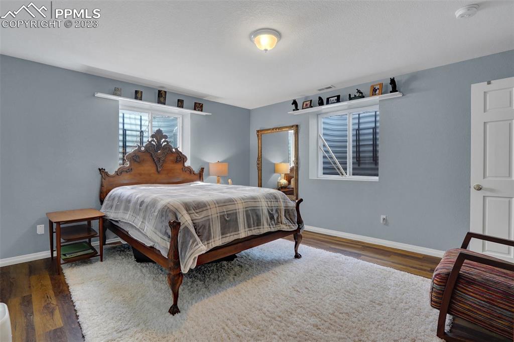 3805 Curtis Road Peyton, CO 80831 - Photo 39 of 48 a bedroom with a bed and a window