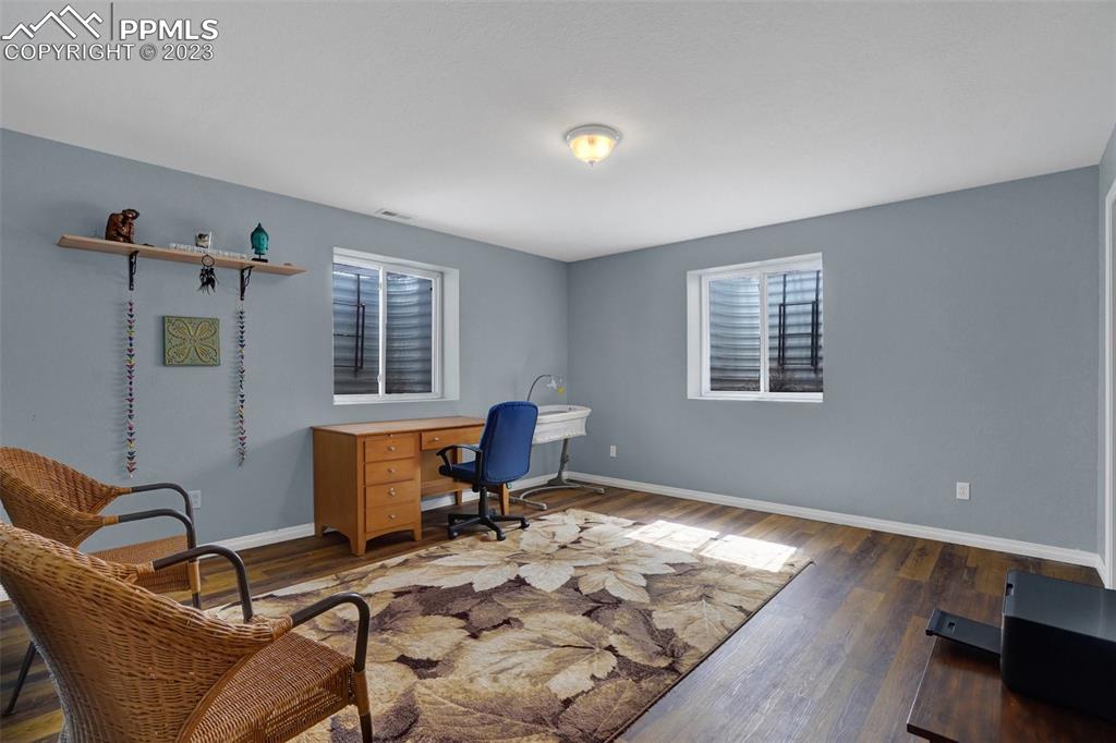 3805 Curtis Road Peyton, CO 80831 - Photo 40 of 48 a workspace with furniture and window