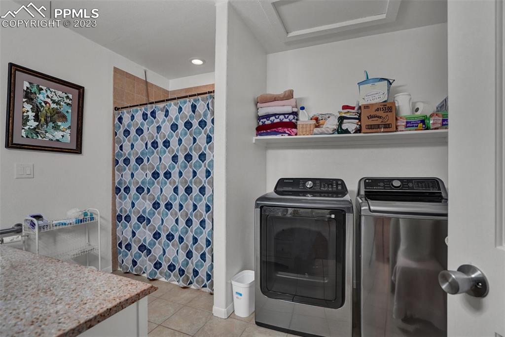 3805 Curtis Road Peyton, CO 80831 - Photo 44 of 48 a view of a storage and utility room with washer and dryer
