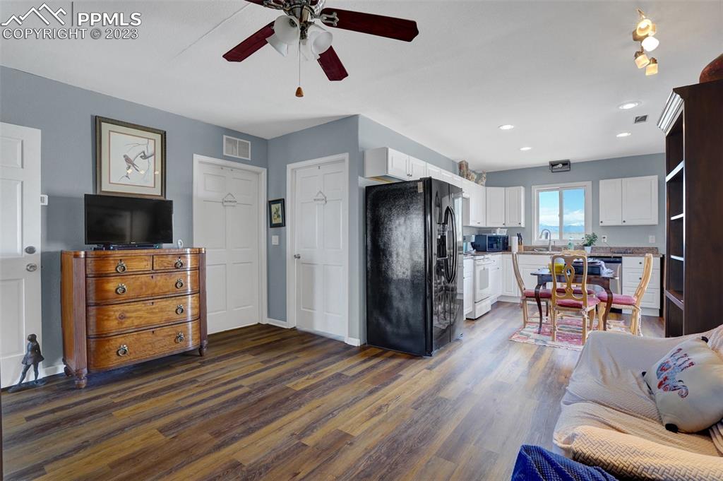 3805 Curtis Road Peyton, CO 80831 - Photo 46 of 48 a view of a livingroom with furniture and a flat screen tv