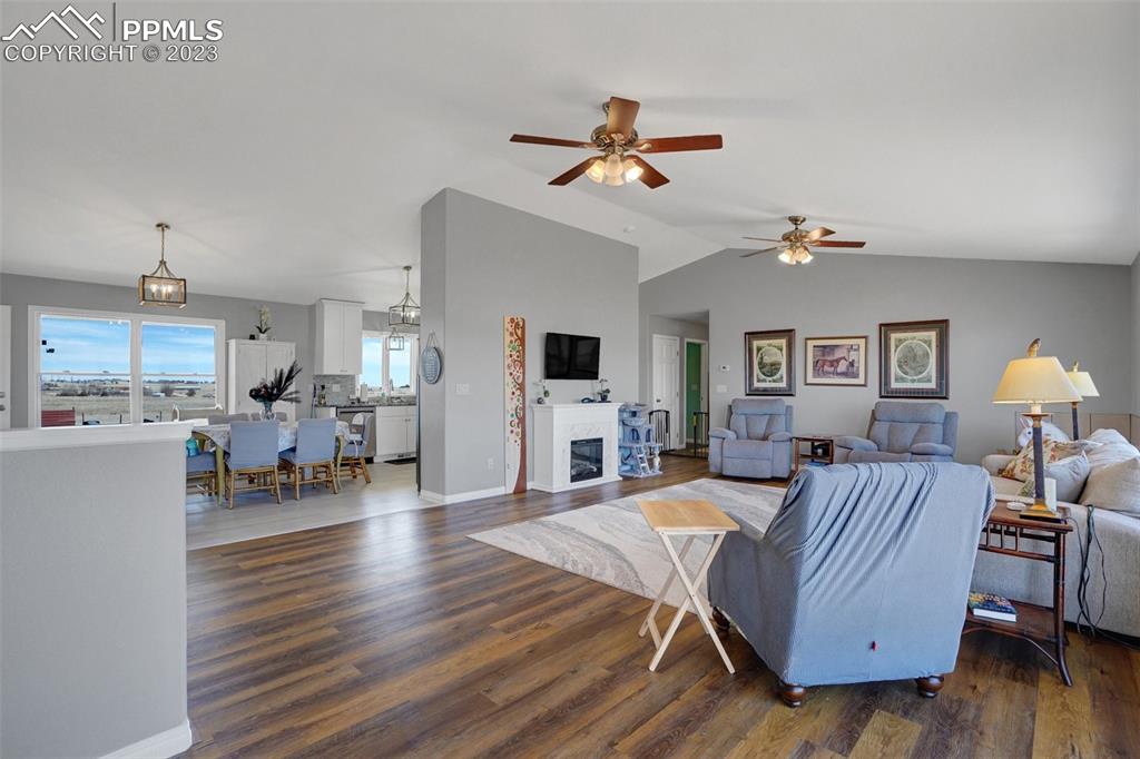 3805 Curtis Road Peyton, CO 80831 - Photo 10 of 48 a living room with furniture and a wooden floor
