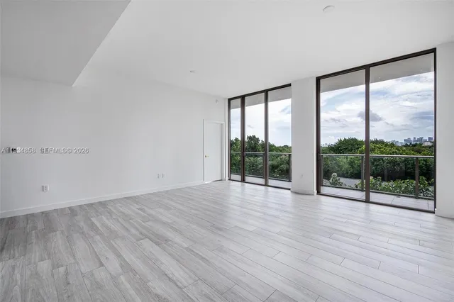 wooden floor in an empty room with window