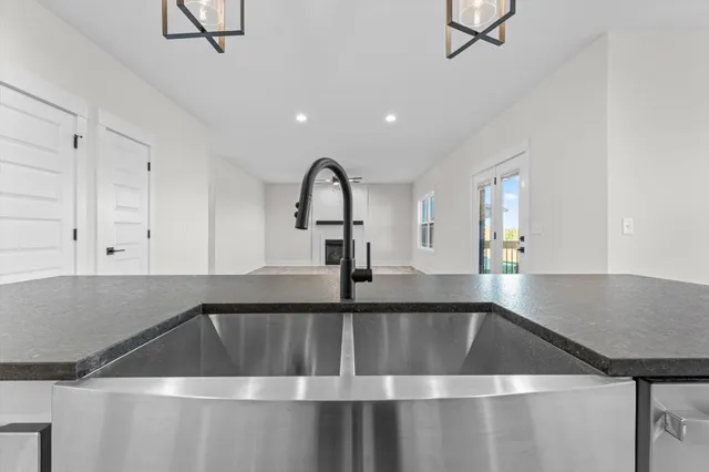 a kitchen with a sink cabinets and window