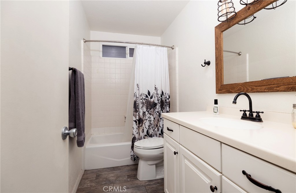 6667 King Street Chino, CA 91710 - Photo 13 of 21 a bathroom with a sink a toilet and a mirror