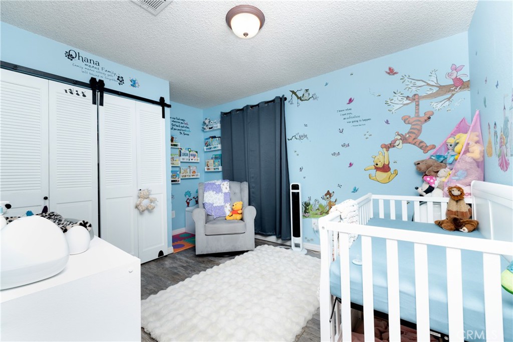 6667 King Street Chino, CA 91710 - Photo 14 of 21 a bedroom with a bed and furniture