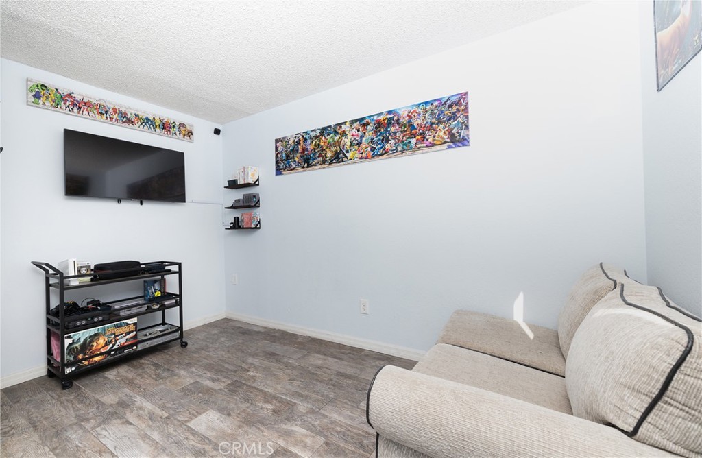 6667 King Street Chino, CA 91710 - Photo 15 of 21 a living room with furniture and a flat screen tv
