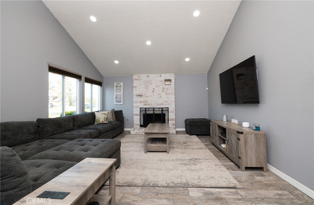 6667 King Street Chino, CA 91710 - Photo 3 of 21 a living room with furniture and a flat screen tv