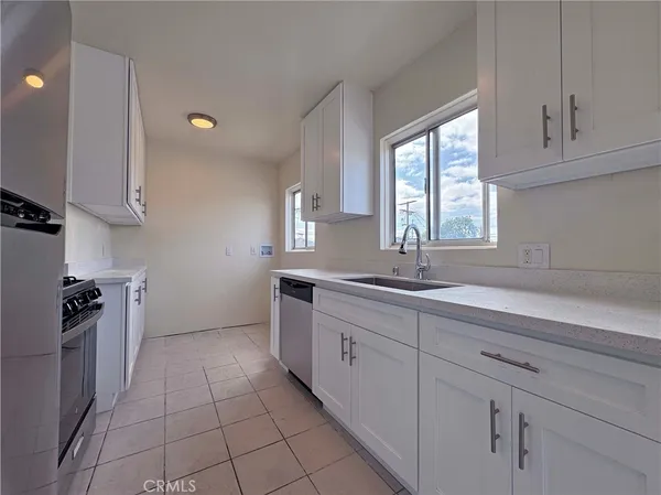 a kitchen with a sink and cabinets