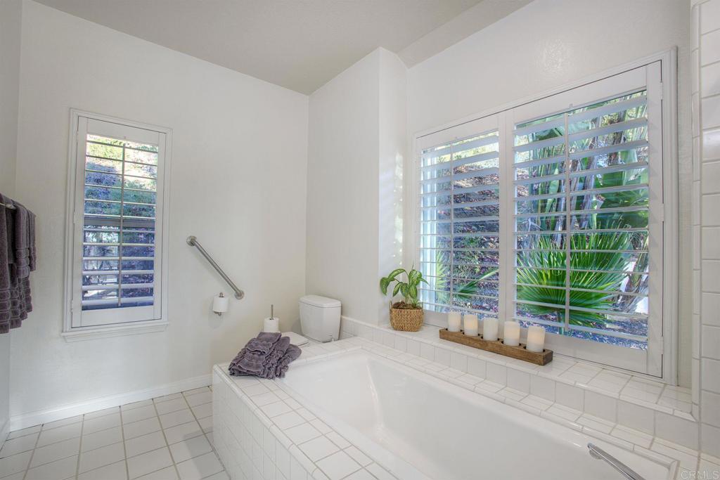 31220 Aquaduct Road Bonsall, CA 92003 - Photo 19 of 36 a bedroom with a bed and glass door